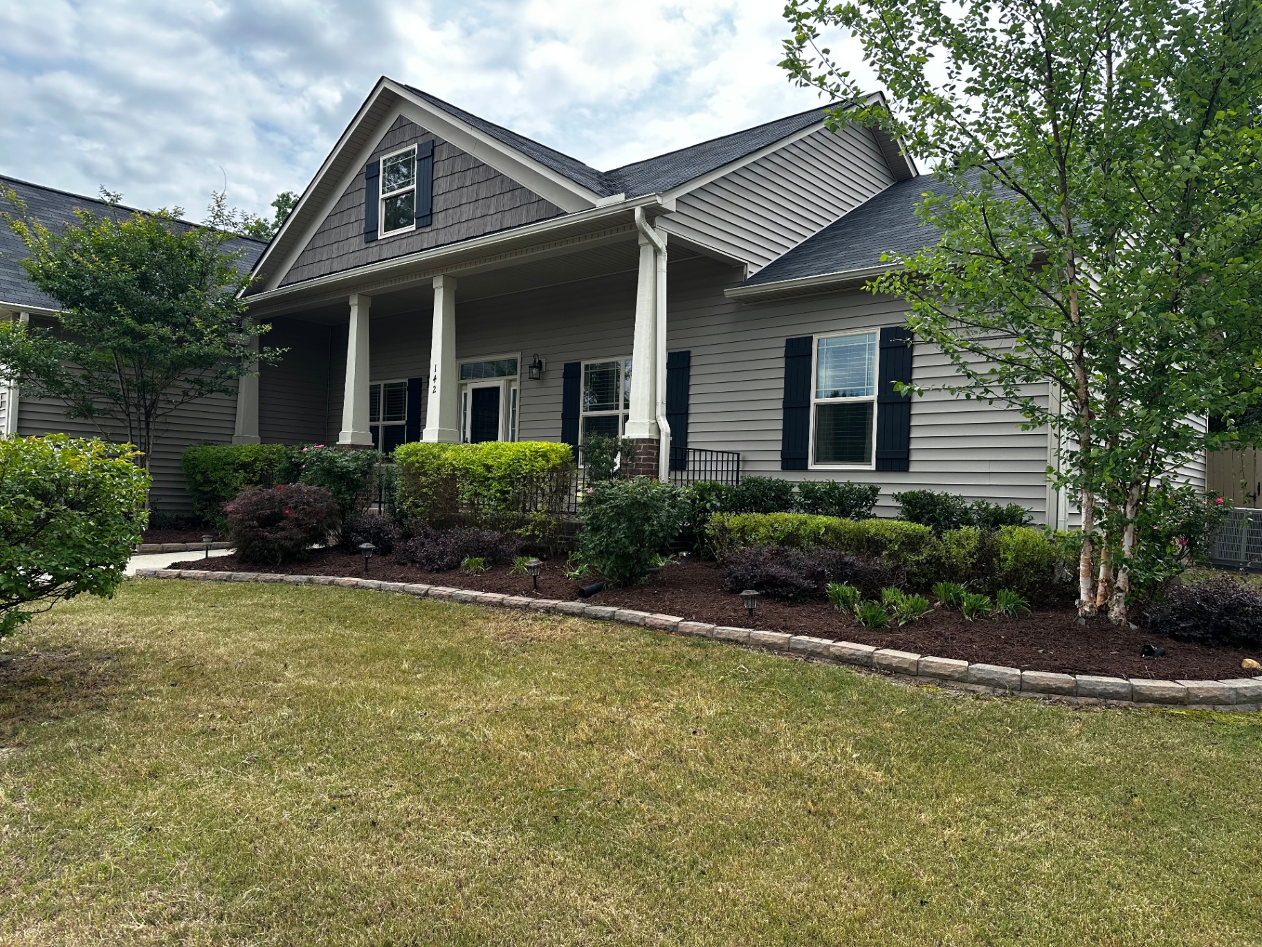 Beautiful landscaped home with manicured yard